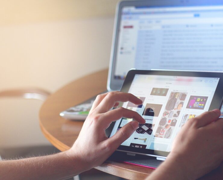 hand touching a touchscreen device